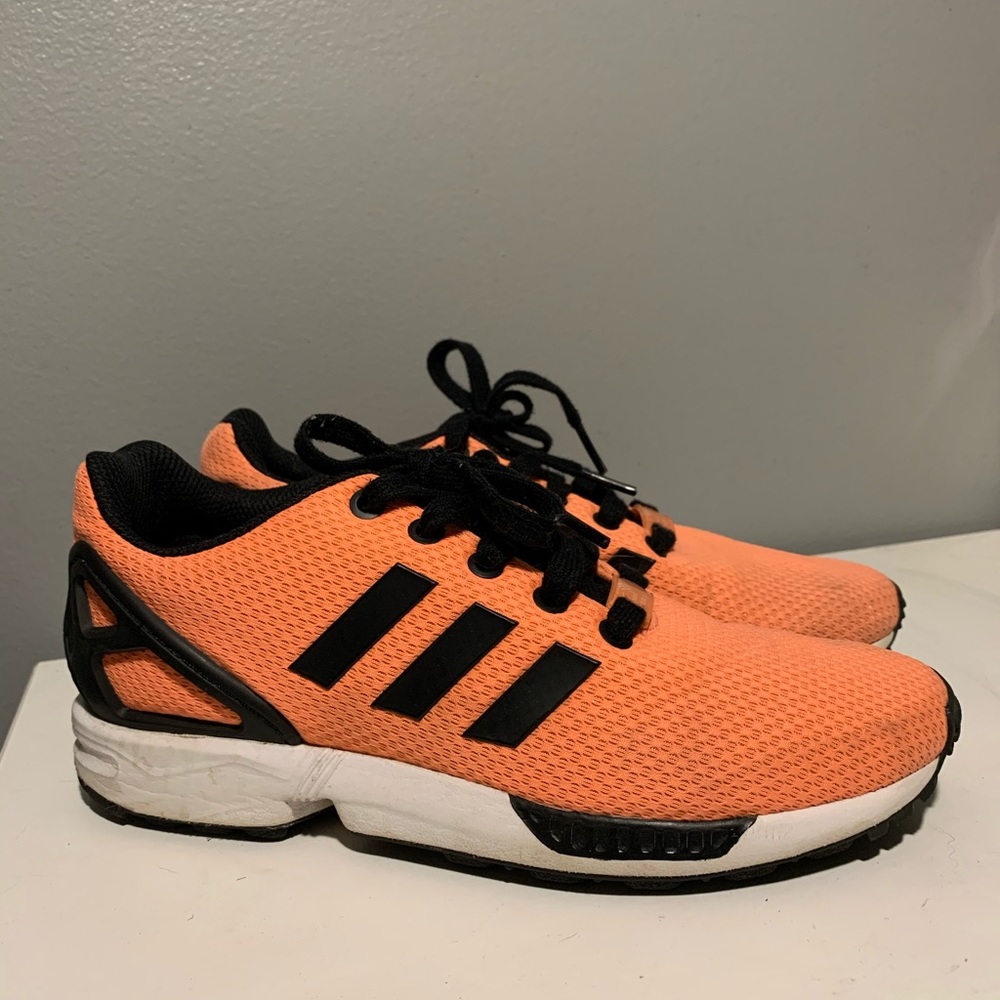 Adidas orange athletic shoe